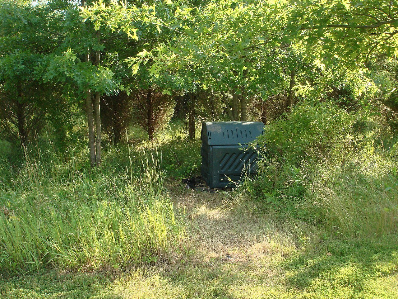 Green compost bin used for decomposing organic material