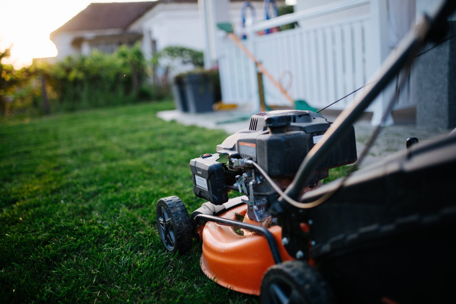 Close-up of a lawn mower standing on a grassy yard