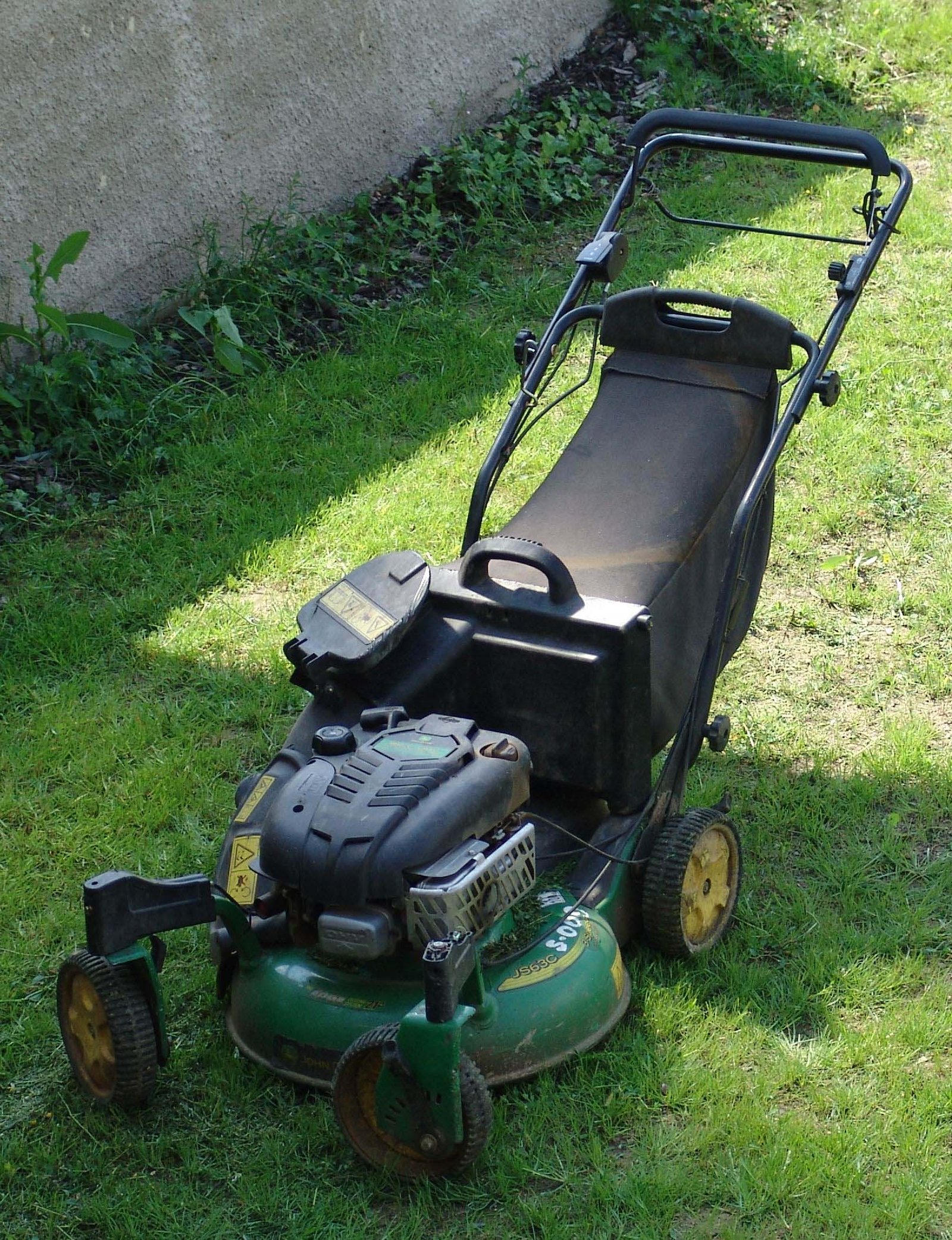 John Deere walk-behind lawn mower on grass