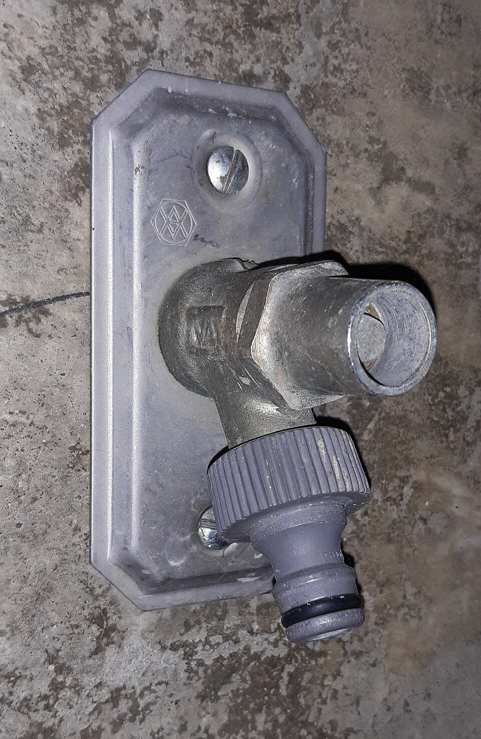 Close-up of a garden hose with a quick-connect fitting